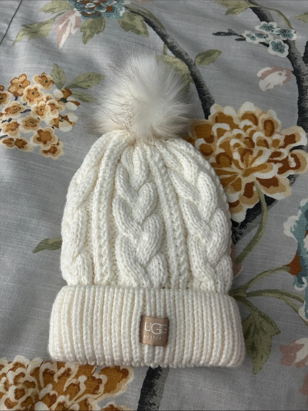 UGG  Ivory Cable Knit Beanie with Faux-Fur Pom